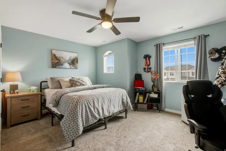 Recessed lighting, ceiling fan, carpet flooring, and window with blinds