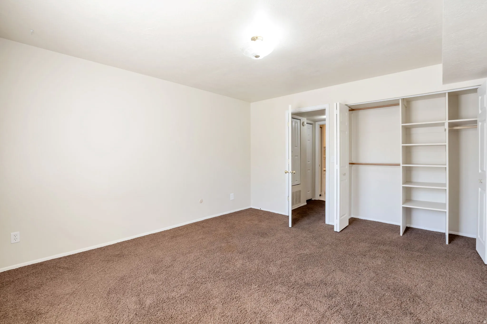 Bedroom with Large Closet with Shelving