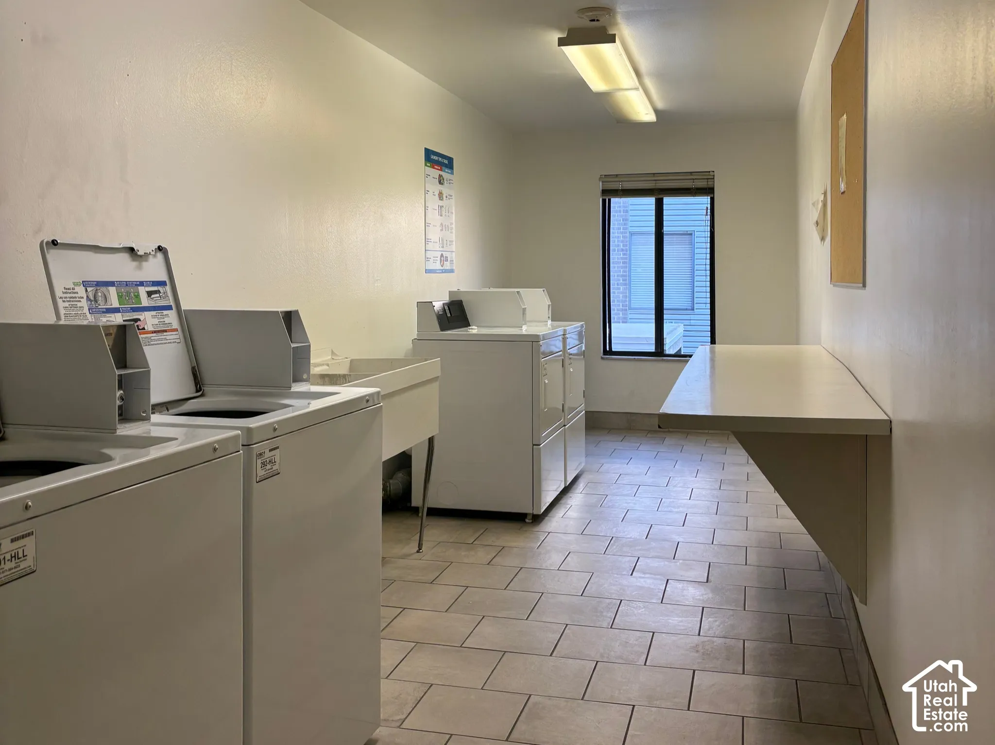 Laundry Room Across Hall from Unit 211