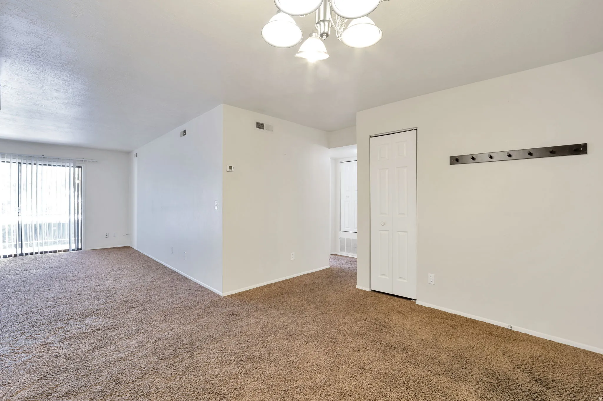 Dining Area Looking Into Living Room and Hallway
