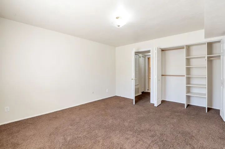 Bedroom with Large Closet with Shelving