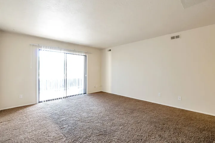 Living Room with Sliding Glass Doors Leading Out to Balcony