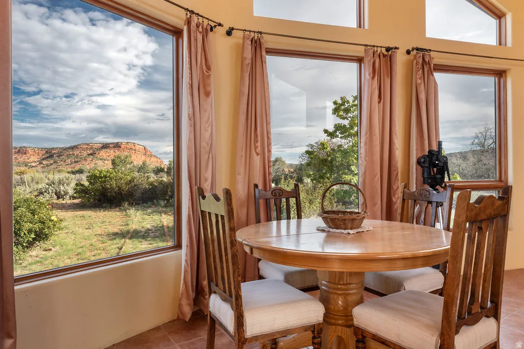 Expansive window wall with natural wood trim, providing abundant natural light