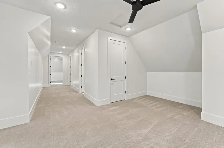 Carpeted flooring, recessed lighting, and a modern ceiling fan