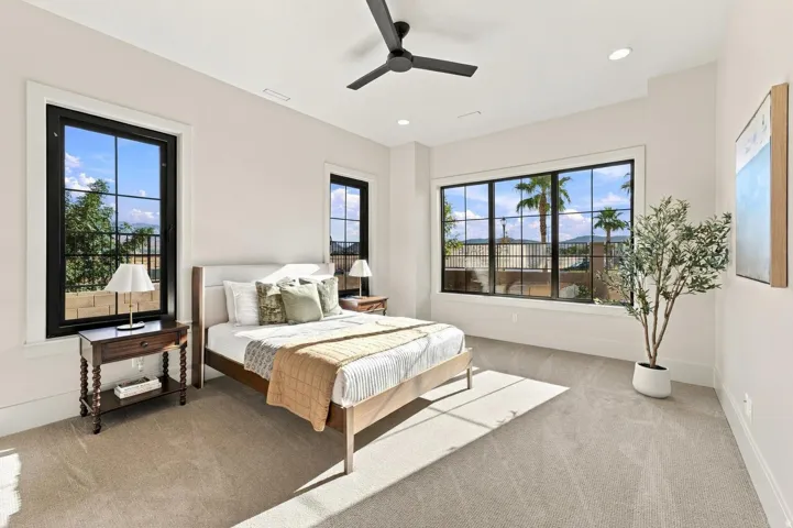 Recessed lighting, ceiling fan, and carpeted flooring