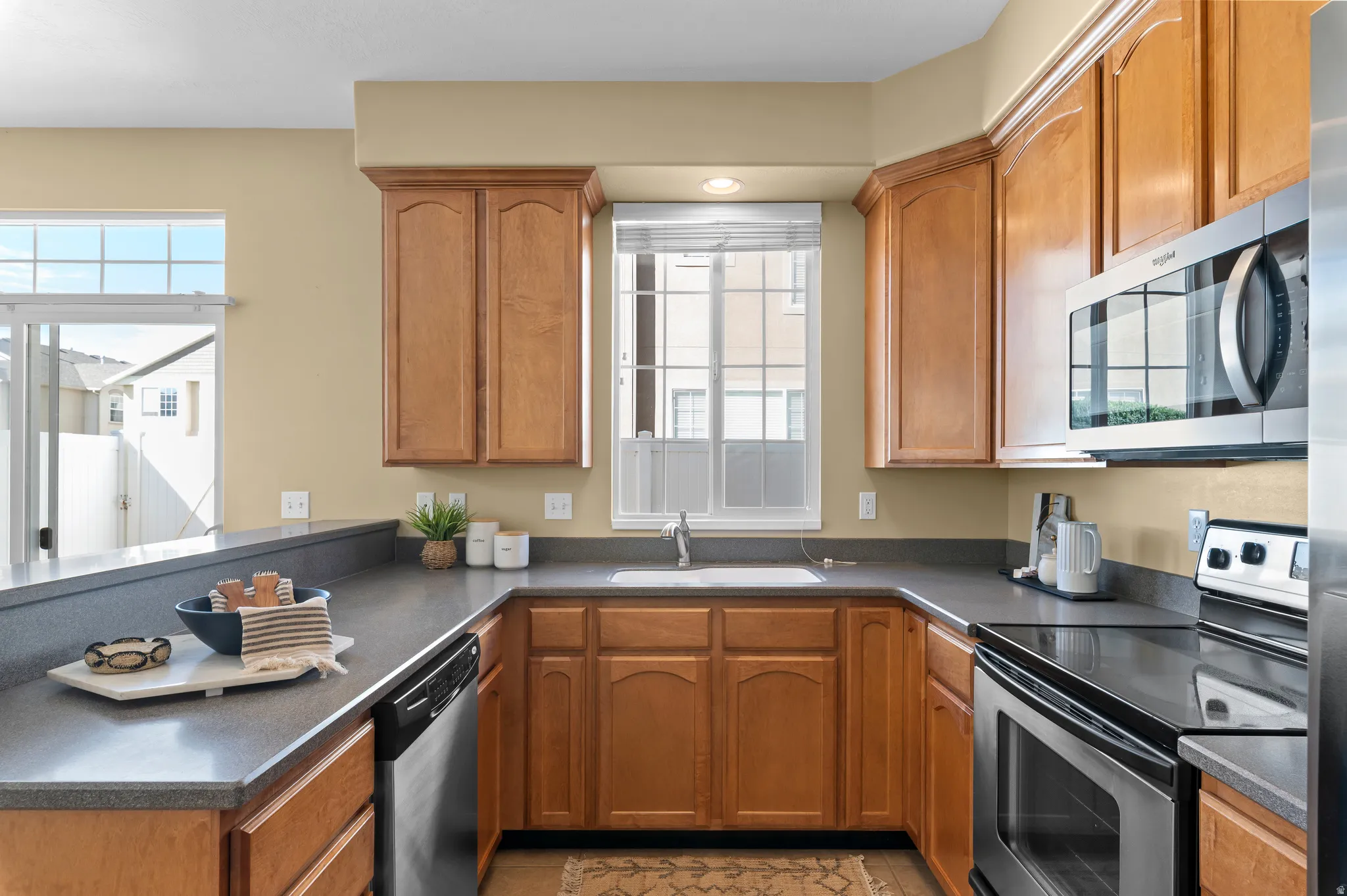 Solid surface countertop, smooth surface range, stainless steel appliances