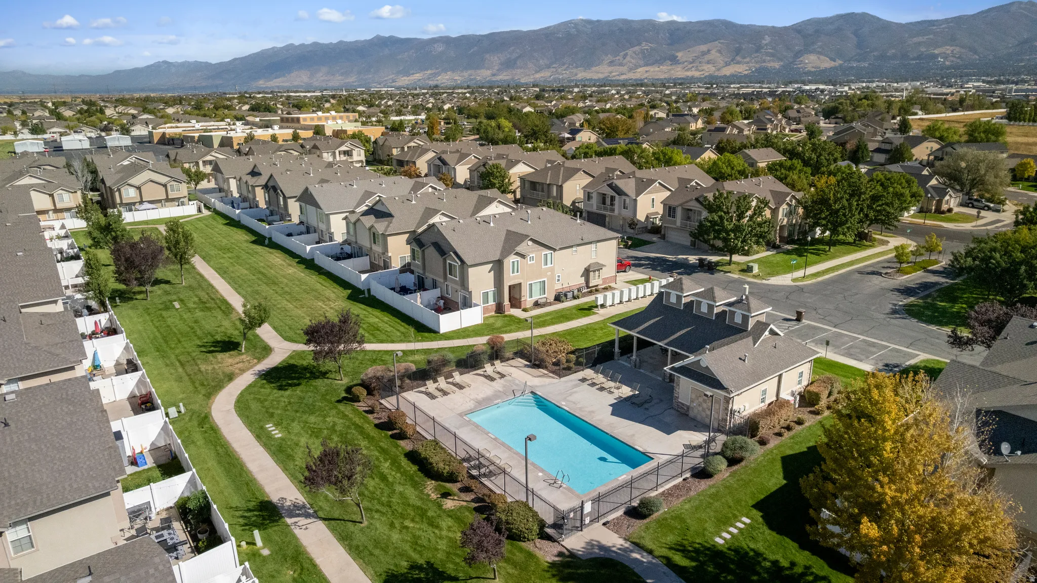 Community swimming pool with adjacent clubhouse building