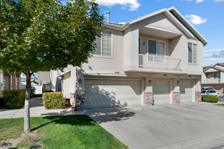 Double car garage located on the side of the unit