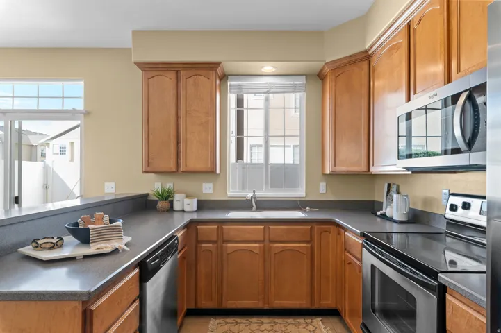Solid surface countertop, smooth surface range, stainless steel appliances