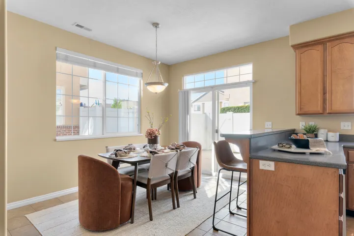 Glass sliding door provides access to private patio