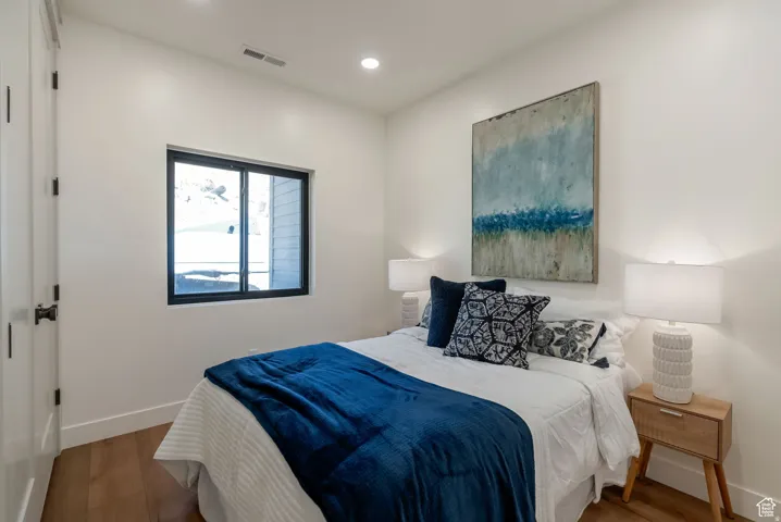 Hardwood-style flooring with white walls