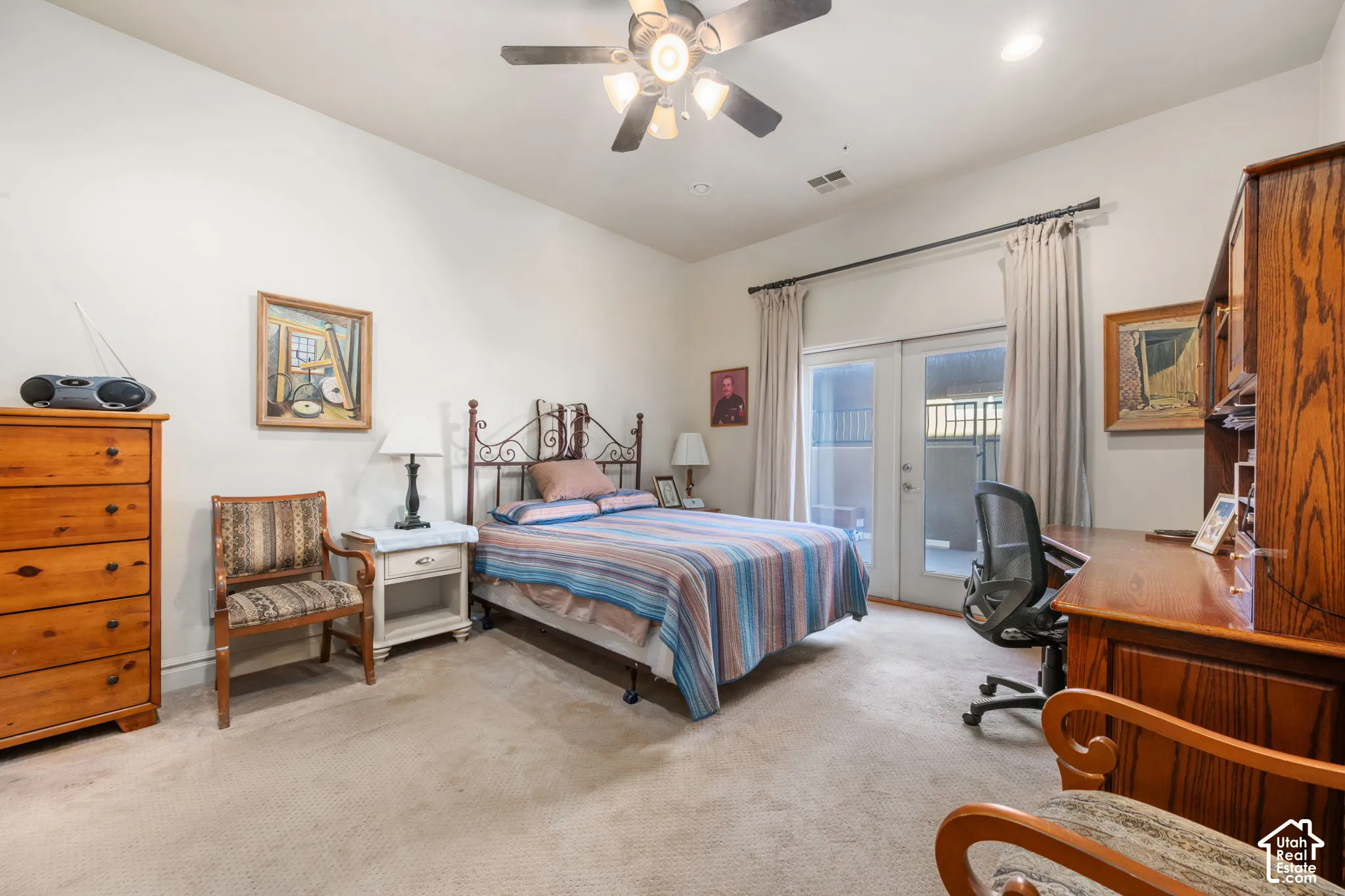 Recessed lighting, ceiling fan, carpet flooring, and French doors leading to an outdoor area