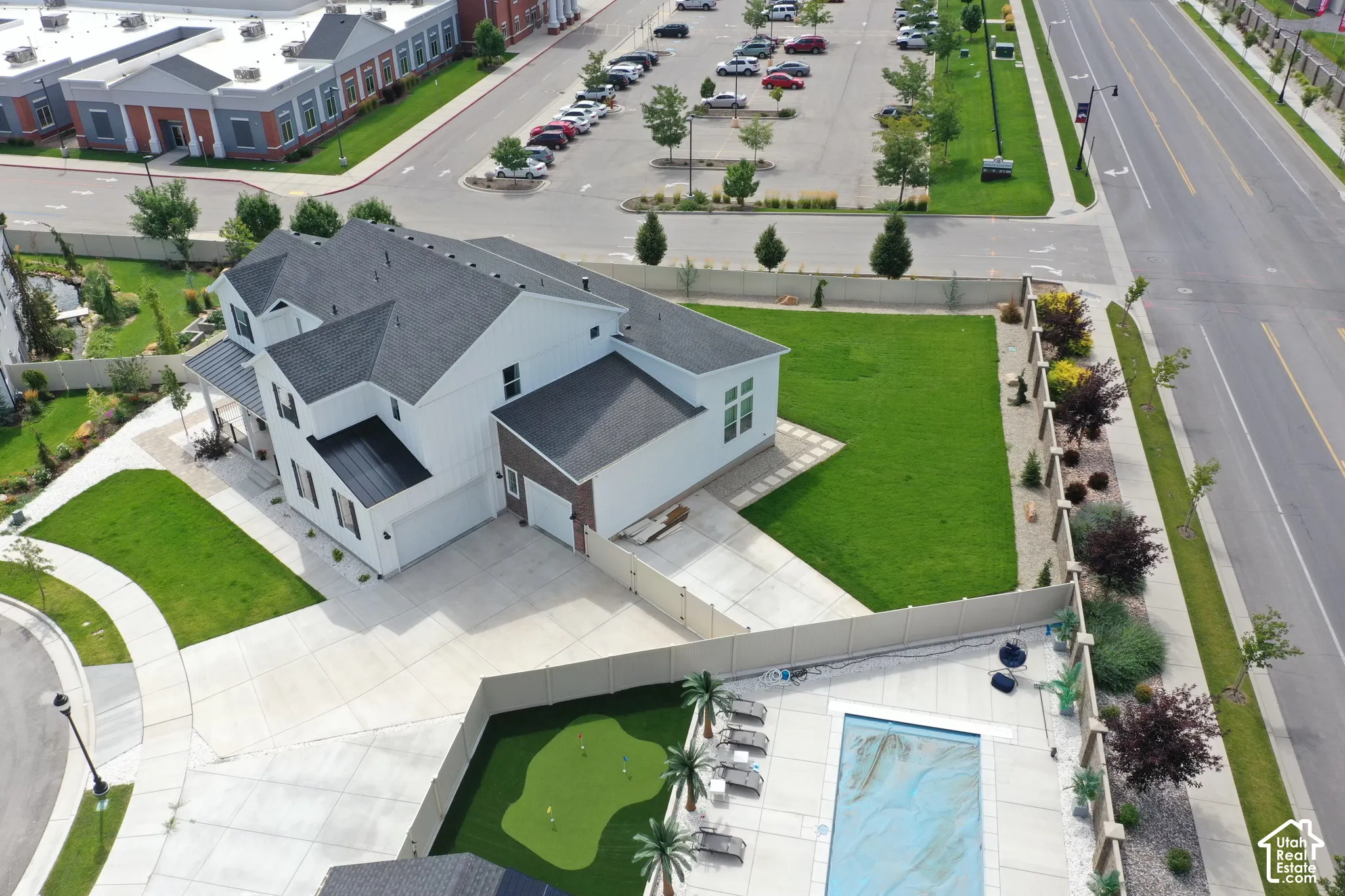 Modern exterior with white siding and dark roofing