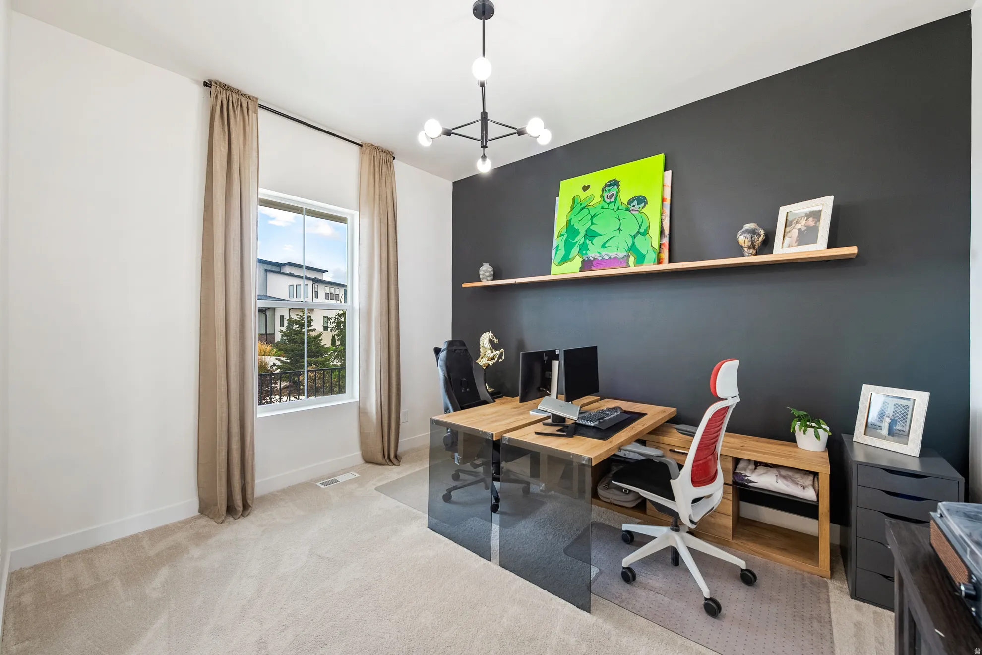 Accent wall, neutral-toned curtains, single window, overhead lighting fixture, and carpeted flooring
