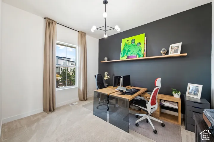 Accent wall, neutral-toned curtains, single window, overhead lighting fixture, and carpeted flooring