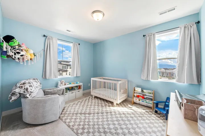 Light blue walls with a flush-mount ceiling light