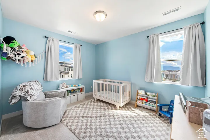 Light blue walls with a flush-mount ceiling light