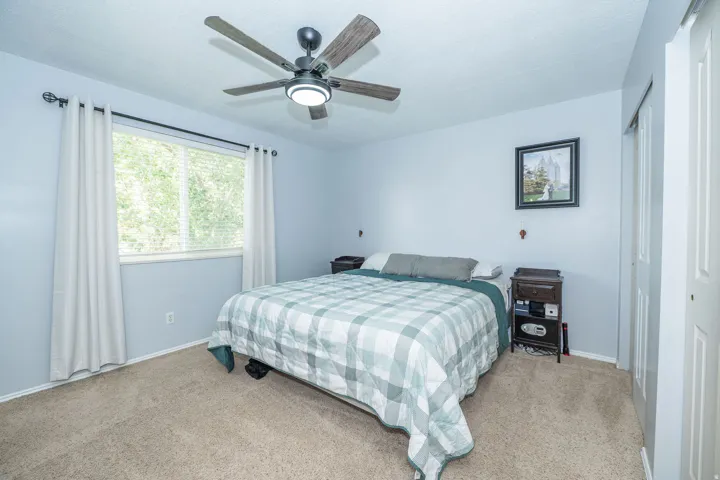 Recessed lighting with a ceiling fan, light blue walls, and carpet flooring