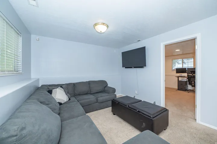 Recessed window with blinds and flush-mount ceiling light fixture