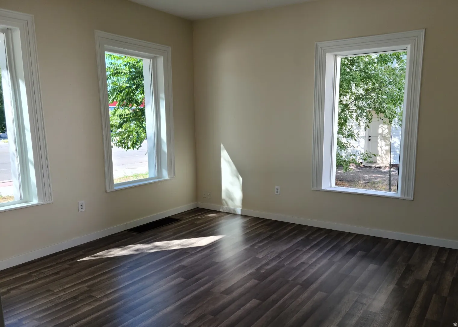 Wood-finish flooring with crisp white trim