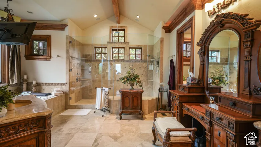 large wood beams and trim, Italian Stone radiant heated floors,  glass-enclosed two showers,, large built-in soaking tub, and a vanity with a stone  countertop