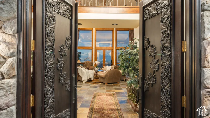 Artisan Hand-Carved African Wood Mahogany entry doors and radiant heated stone floors