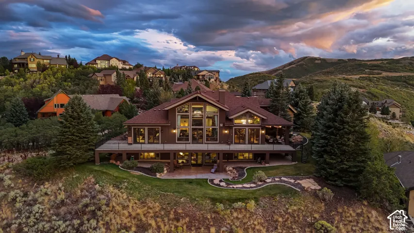 Panoramic views with floor-to-ceiling windows and a 1500ft Lifetime African Wood wrap-around deck