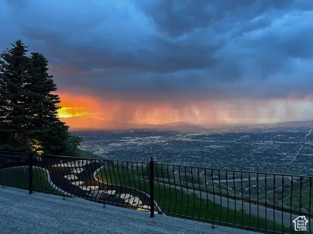 Deck views at sunset with Expansive elevated landscape with a city backdrop and Oquirrh Mountain Range