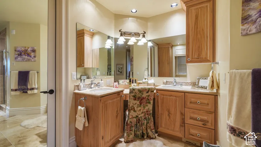 Guest bath-Dual sink vanity with light wood cabinetry, recessed lighting, wall-mounted mirror, and tile flooring