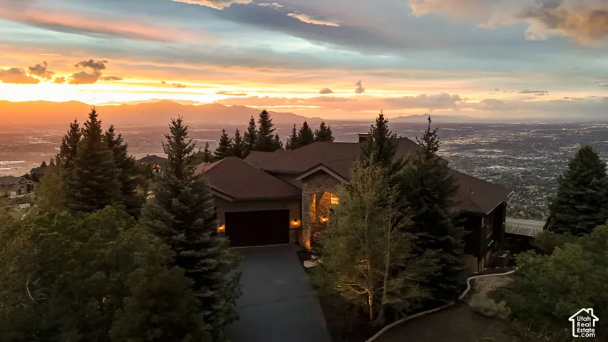 Distinctive Stone, Rock, and wood facade with dramatic sunset sky views