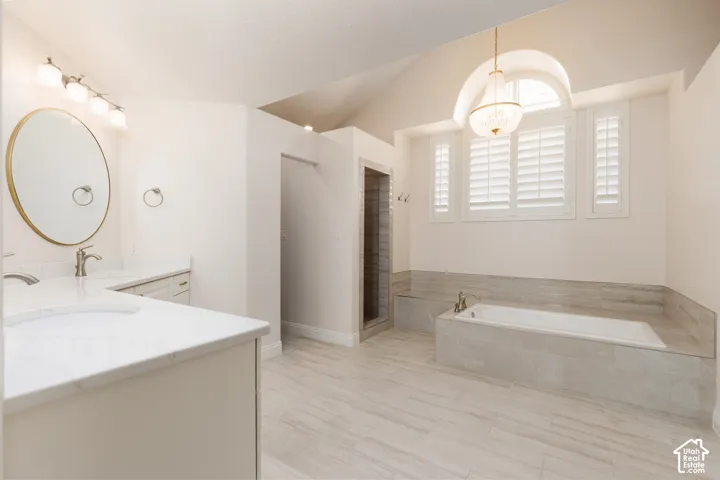 Dual vanity with quartz countertops, undermount sinks, and brushed nickel fixtures