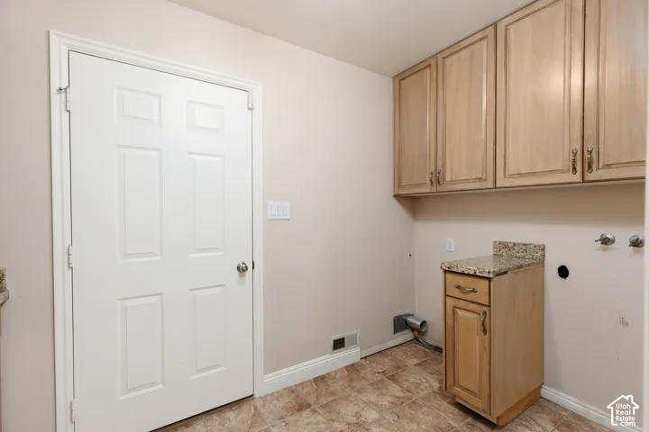 Built-in cabinetry with a stone-finish countertop
