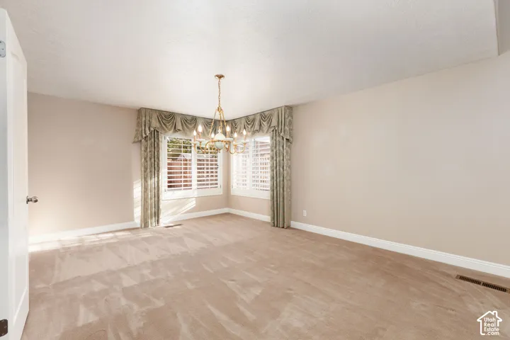 Neutral tone walls complement the light-colored carpeting