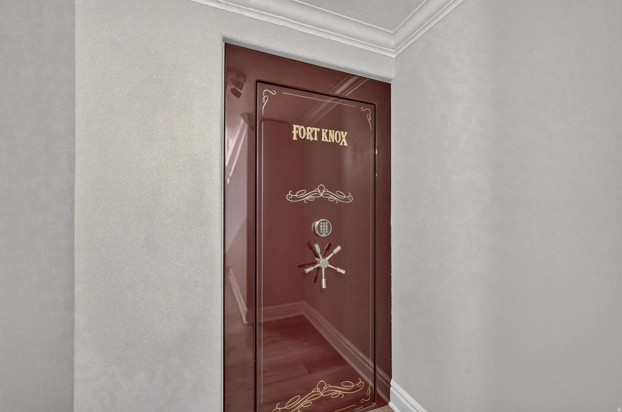 Built-in security safe with a combination lock and decorative embellishments