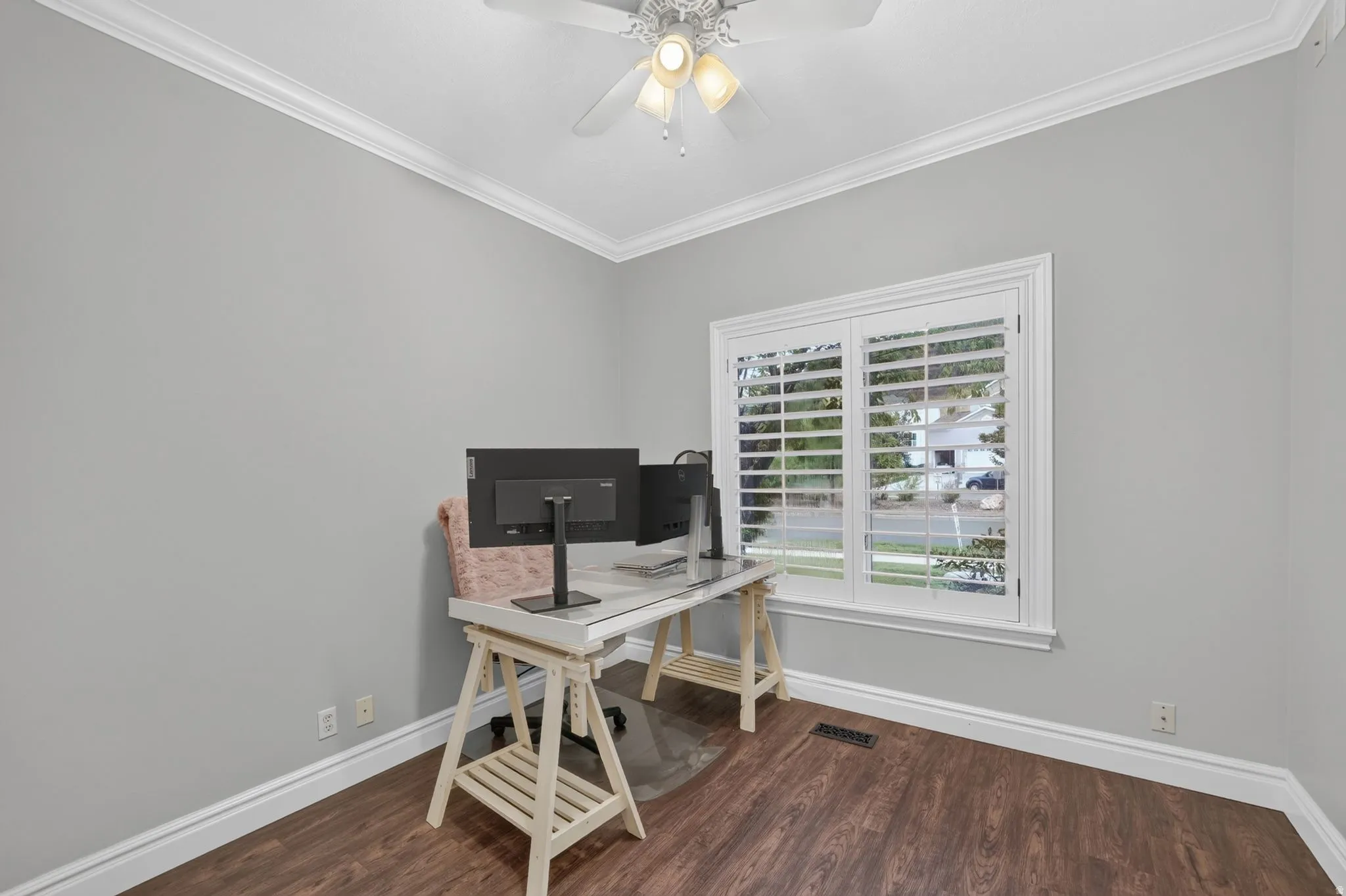 Recessed ceiling fan with light fixture, crown molding, plantation shutters, wood-finish flooring, and white trim