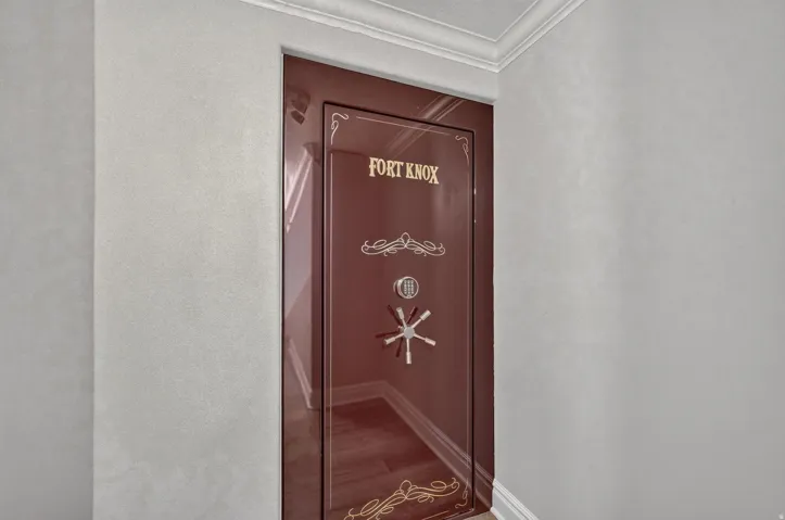 Built-in security safe with a combination lock and decorative embellishments