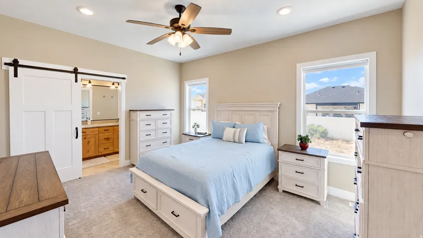 Spacious room with carpeted flooring, a ceiling fan, and recessed lighting