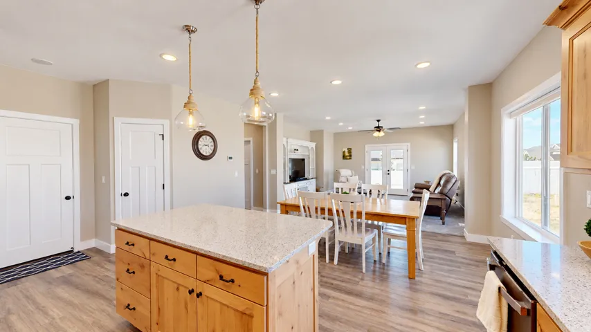 Open-concept living space with wood-finish flooring
