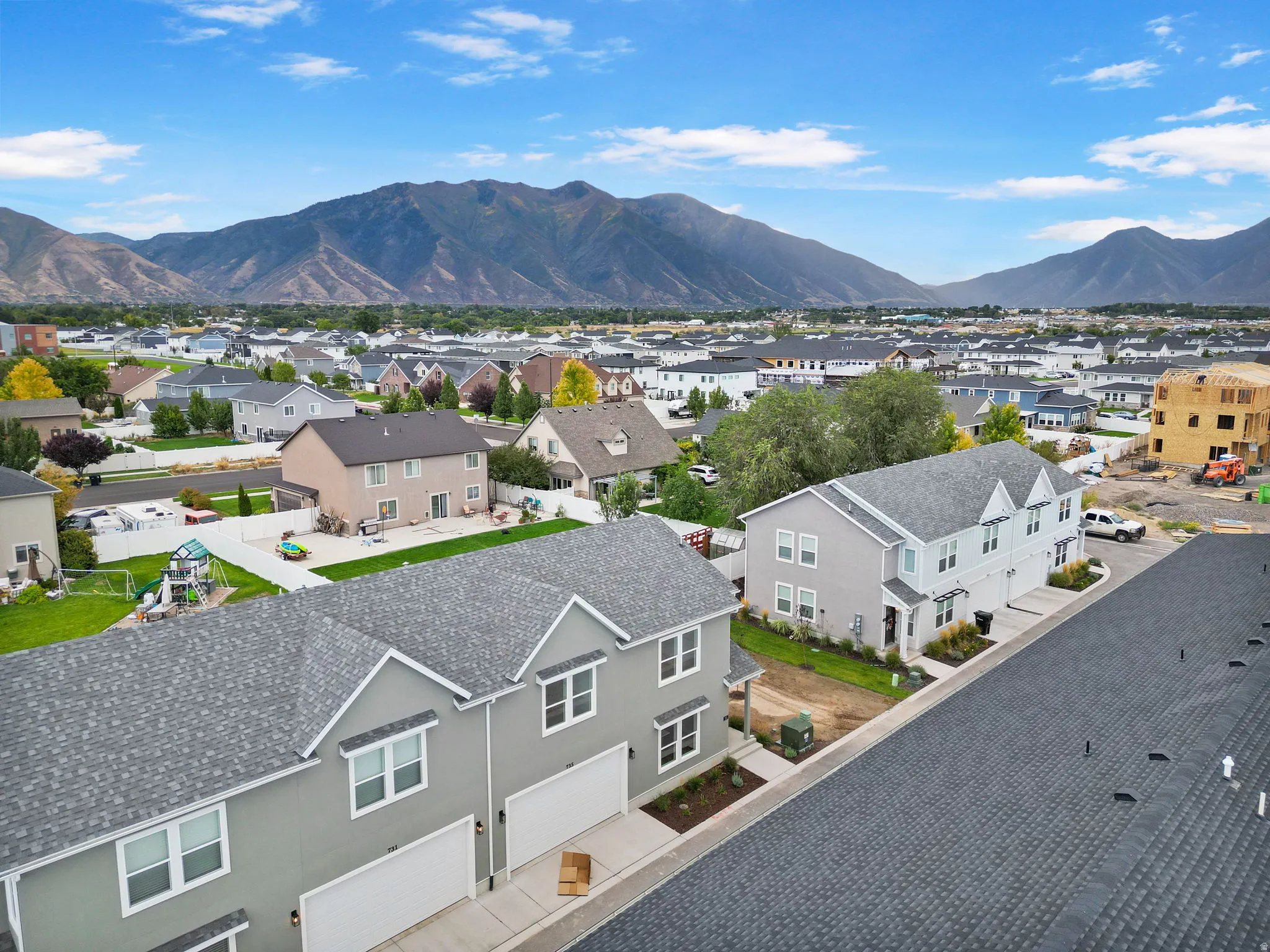 Expansive mountain backdrop with a residential neighborhood