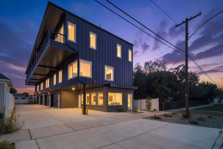Modern facade with vertical siding and brick detailing