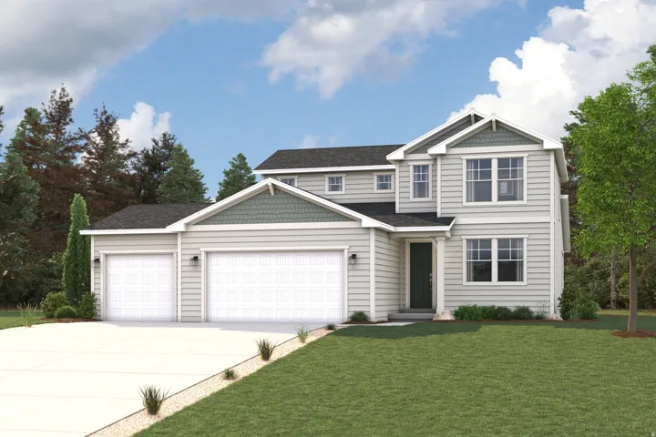 Two-story residence featuring light-colored siding with contrasting green accents, a two-car garage with individual doors, a dark entry door, and a concrete driveway
