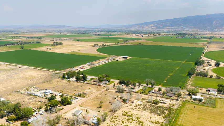 Expansive agricultural land featuring cultivated fields and undeveloped parcels