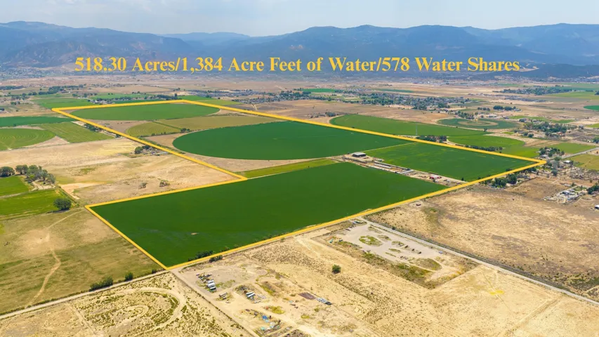 Expansive agricultural land featuring a center-pivot irrigation system
