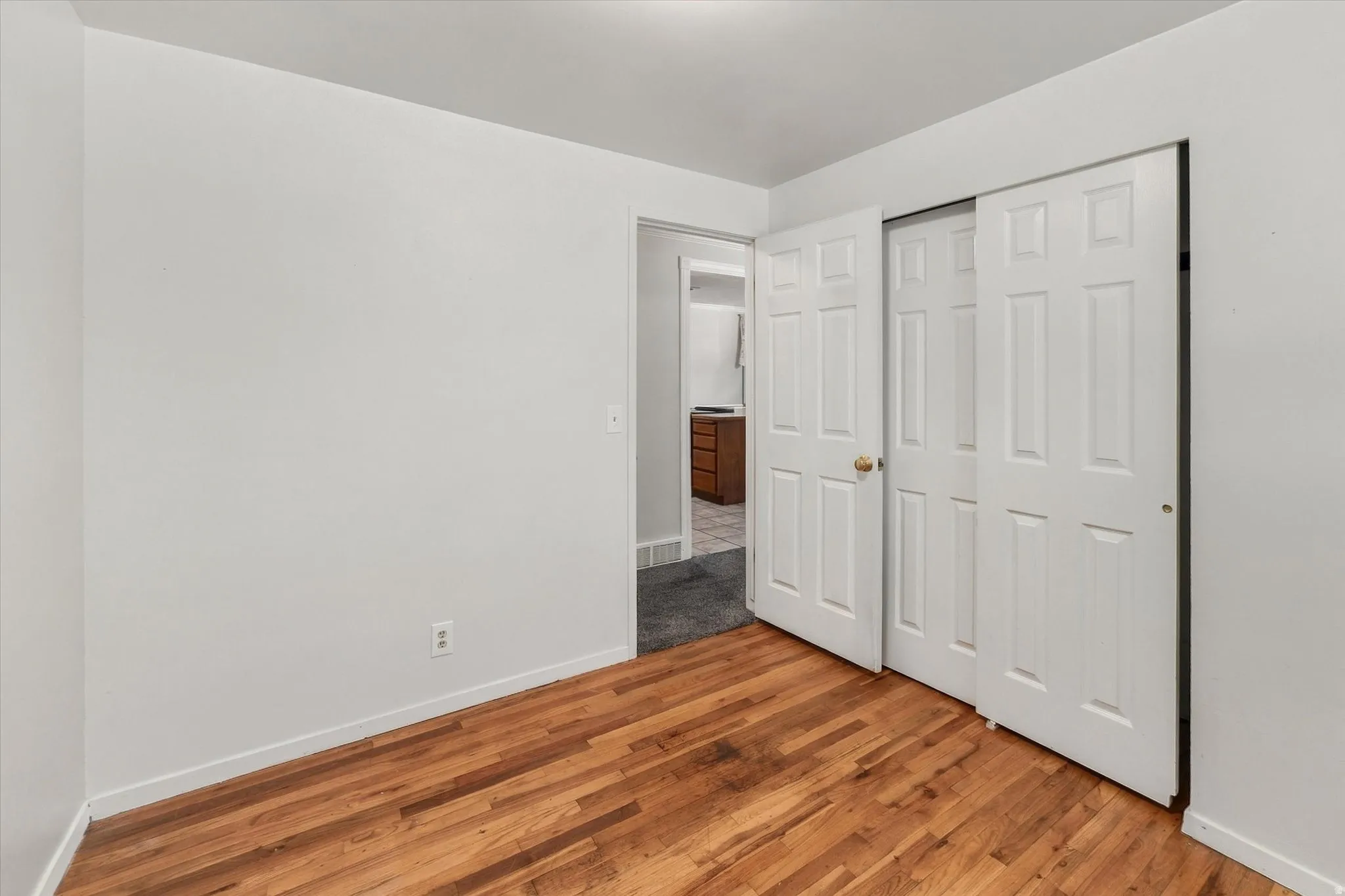 Wood-finish flooring with crisp white walls