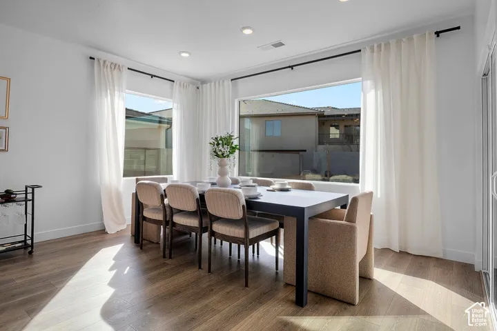 Recessed lighting illuminating wood-finish flooring