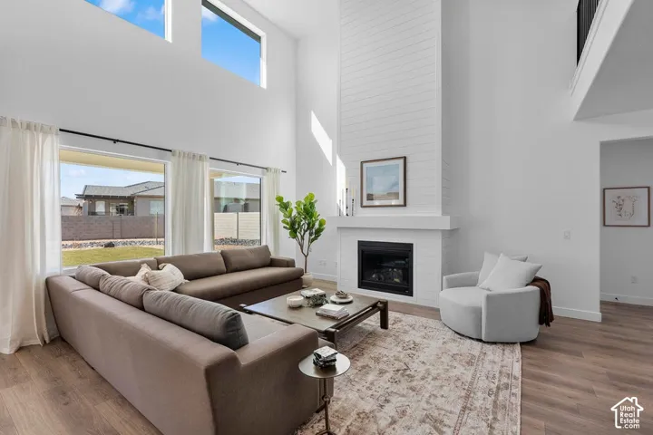 Vaulted ceiling with high transom windows and wood-finish flooring