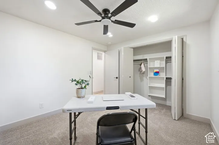 Recessed lighting, ceiling fan, bi-fold closet doors, built-in closet shelving, and carpeting