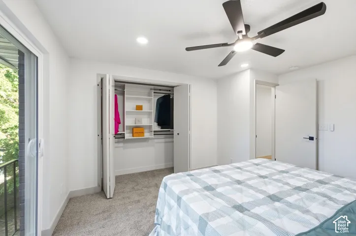 Wall-to-wall carpeting and white walls with recessed lighting