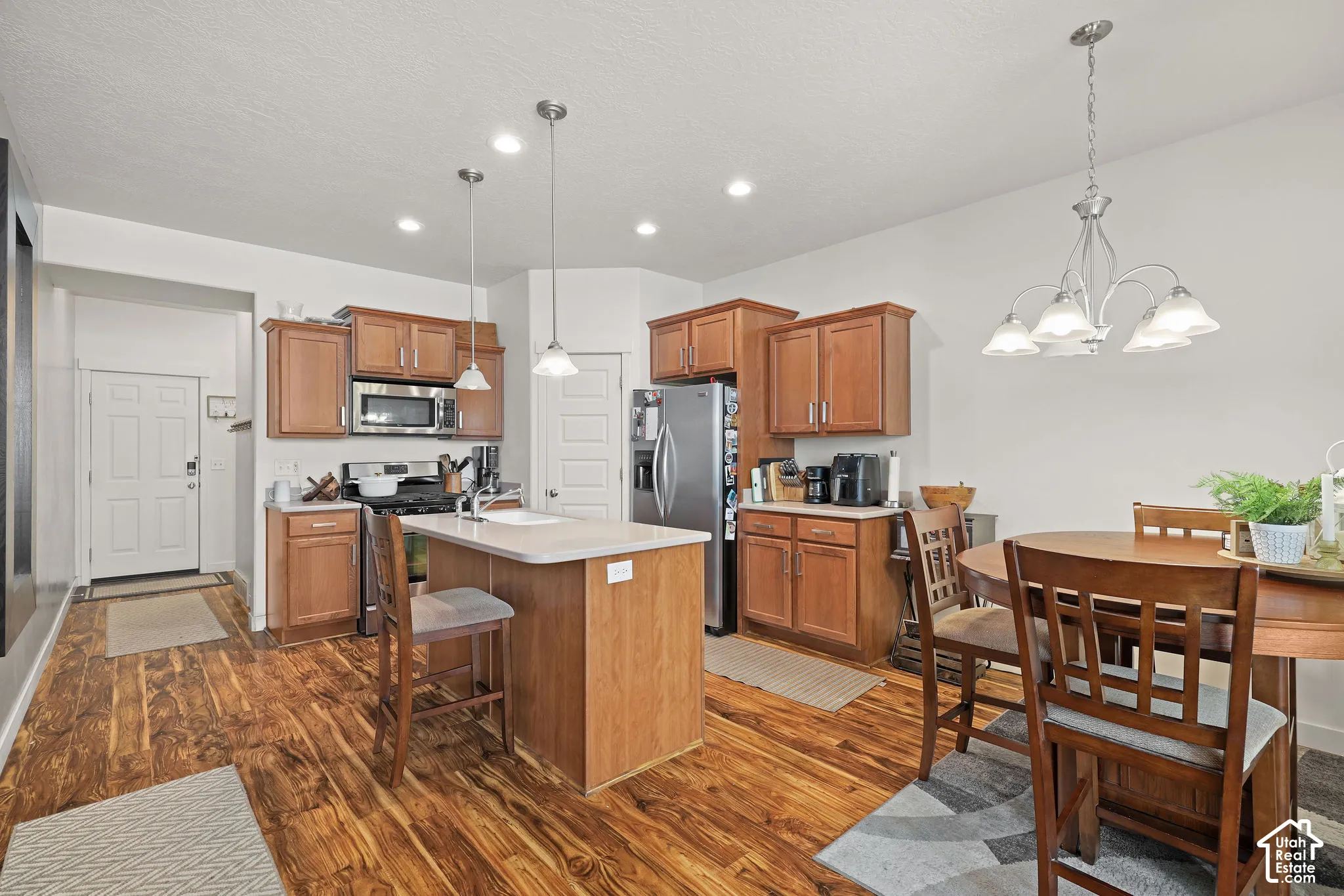 Wood-finish flooring throughout the kitchen and dining area