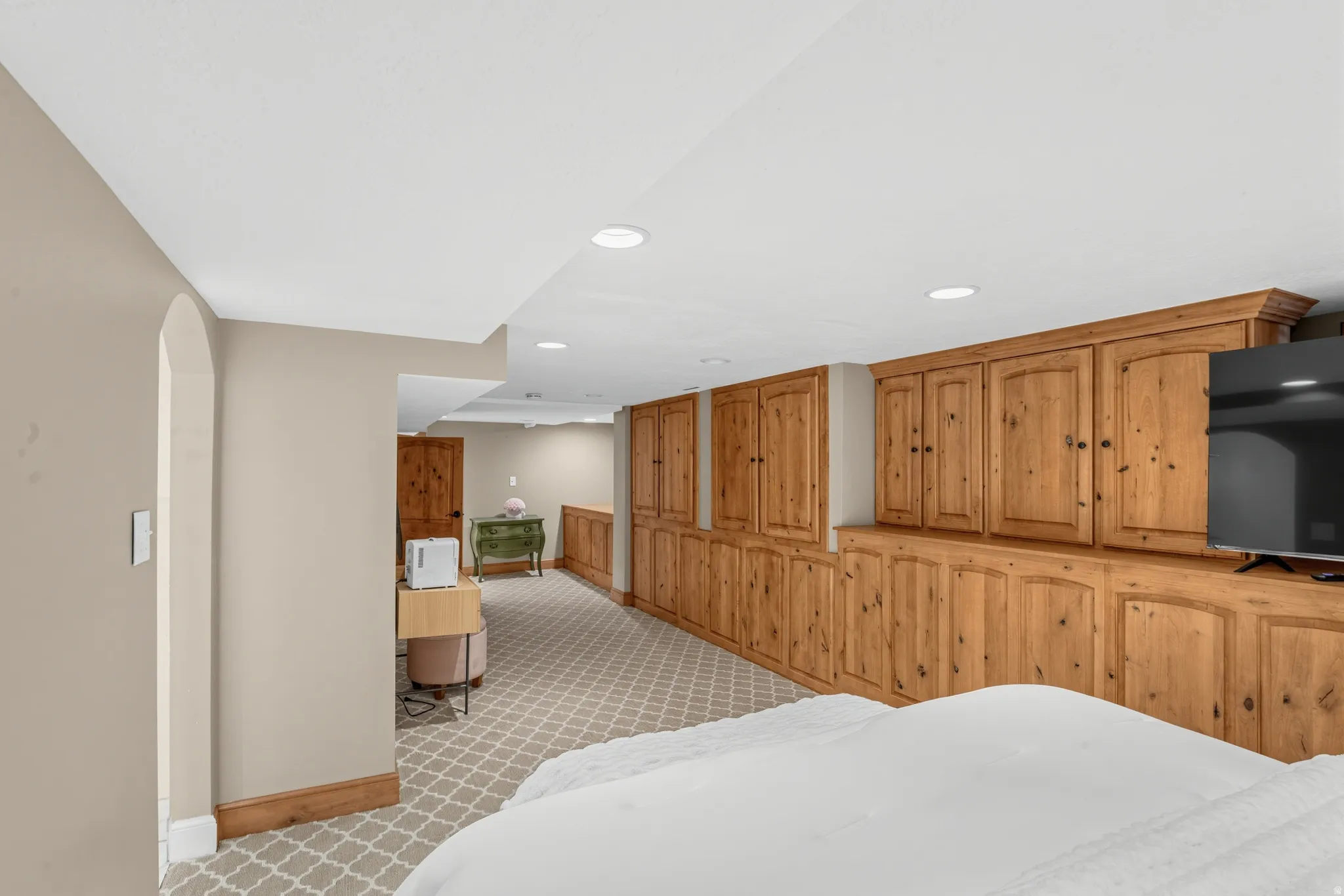Full-wall built-in cabinetry with natural wood finish